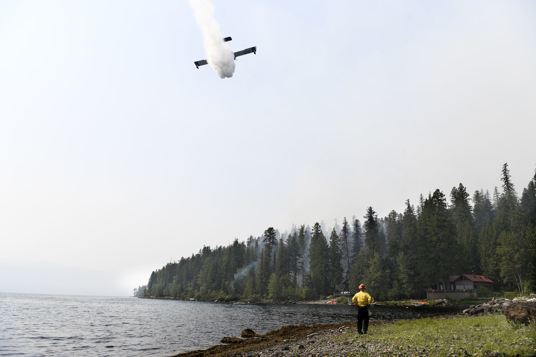 A CL-215 "Super Scooper" drops water